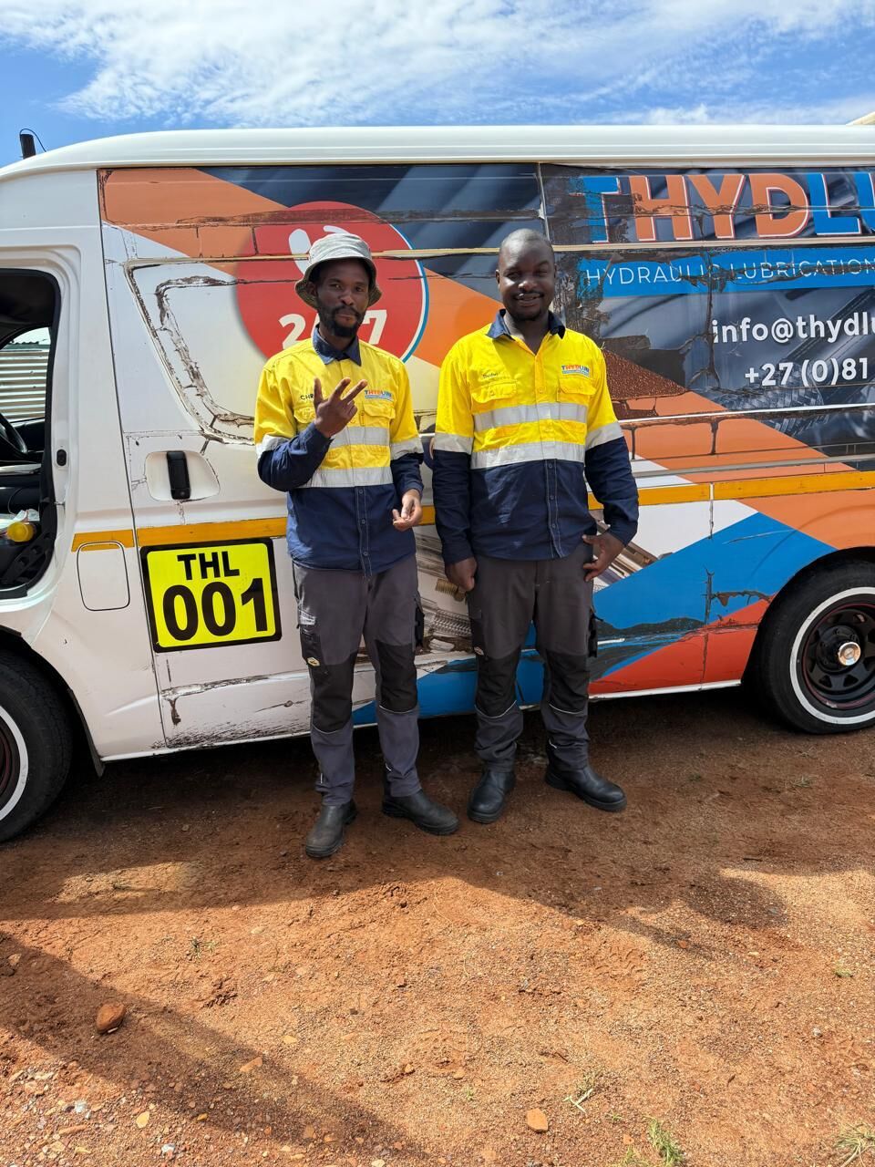 T Hydlube team beside the company service van